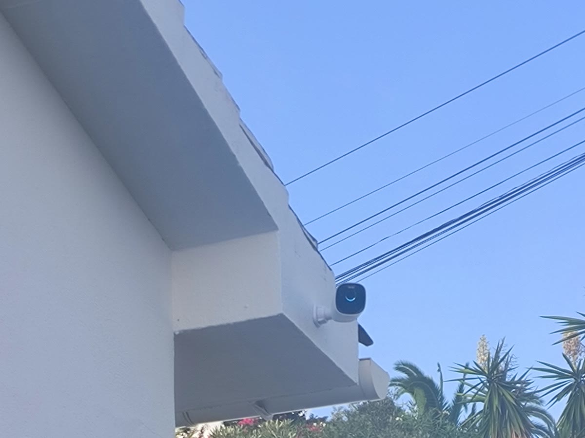 Wired AI camera at a villa roof corner